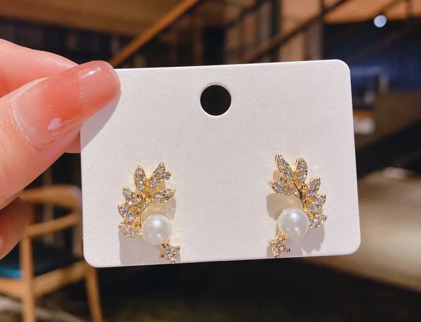 Gold Leaf Pearl Stud Earrings with Crystal Accents