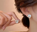 Elegant Sculpted Shell Stud Earrings
